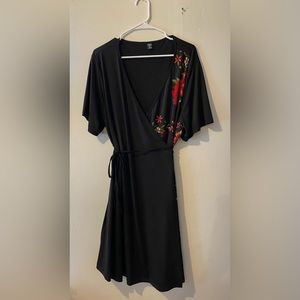 Spandex fabric cross mini dress. Size is 3XL runs smaller. Only tried on once.